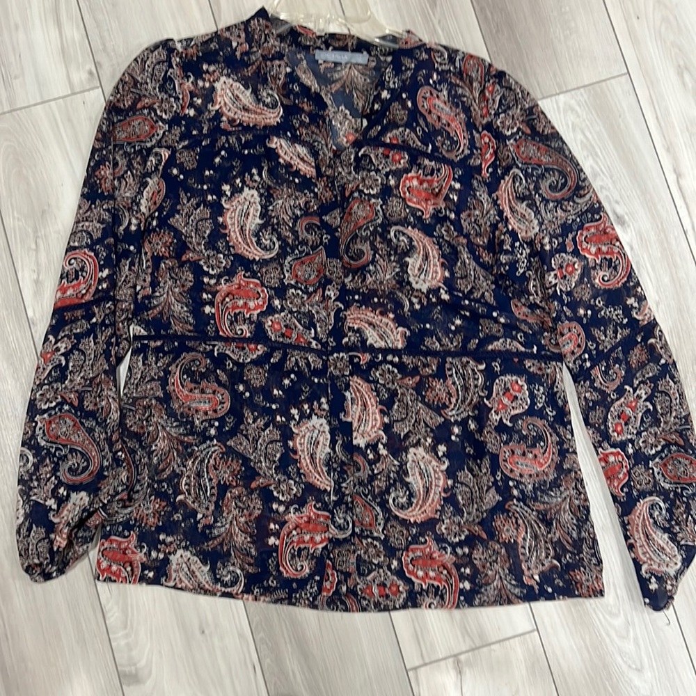 Octavia sheer blouse in paisley over a navy background with front placket